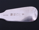 A set of twelve Irish George IV fiddle pattern sterling silver table spoons
