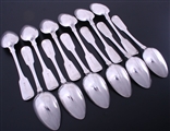 A set of twelve Irish George IV fiddle pattern sterling silver table spoons