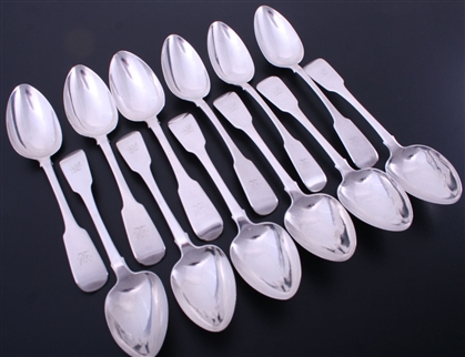 A set of twelve Irish George IV fiddle pattern sterling silver table spoons