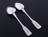 A pair of George III fiddle pattern sterling silver table spoons