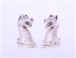 A rare pair of Victorian sterling silver heraldic novelty pepper casters