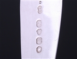 A matched set of three Victorian fiddle pattern sterling silver table spoons