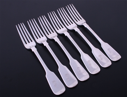 A matched set of six antique fiddle pattern sterling silver table forks