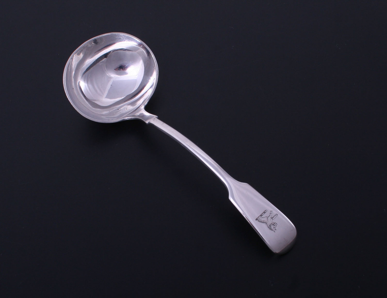 A Victorian sterling silver fiddle pattern sauce ladle