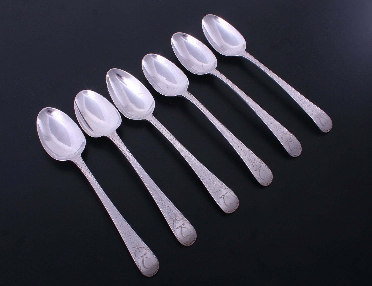 A pretty set of six Old English bright cut sterling silver dessert spoons