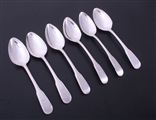 A set of six George III fiddle thread and drop pattern sterling silver dessert spoons