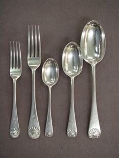 A fine Victorian canteen of Old English with shell pattern sterling silver flatware for twelve people