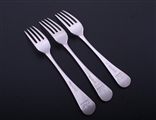 A set of three George III Old English pattern sterling silver table forks