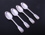 A set of four Victorian fiddle, thread and shell pattern sterling silver table spoons