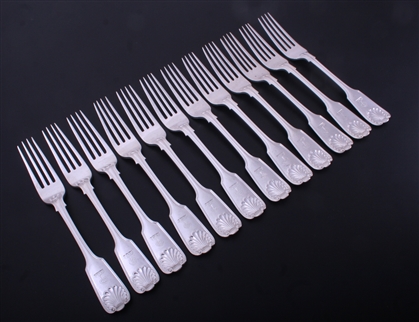 A set of twelve Irish Victorian fiddle, thread and shell pattern sterling silver table forks