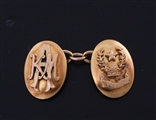 A fine pair of 18ct yellow gold armorial cufflinks