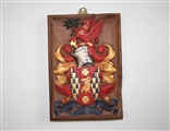 A fine 17th century carved giltwood and polychrome decorated oak armorial panel