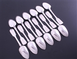 A set of twelve George IV sterling silver fiddle pattern table spoons