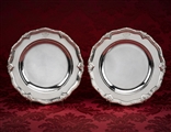 A matched pair of George II silver dishes from the Marlborough Service at Blenheim Palace