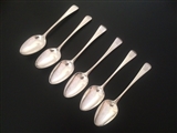 A matched set of six George III Old English pattern sterling silver table spoons