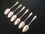 A matched set of six George III Old English pattern sterling silver table spoons