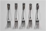 A matched set of five antique fiddle pattern sterling silver dessert forks