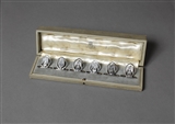 REGIMENTAL INTEREST: A matched set of six sterling silver menu holders