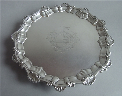AN EARLY GEORGE III SALVER MADE IN LONDON IN 1761 BY EBENEZER COKER.