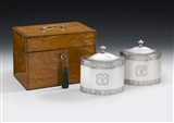 THE FAULKBOURN HALL CASED TEA CADDIES. AN IMPORTANT & VERY UNUSUAL PAIR OF GEORGE III TEA CADDIES MADE IN LONDON IN 1793 BY WILLIAM FRISBEE. ALL CONTAINED WITHIN A CONTEMPORARY SATINWOOD CASE, THE HINGES AND HANDLE ALSO HALLMARKED FOR 1793